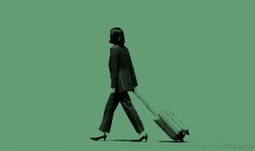 an Asian woman dragging a suitcase against a greenbackground