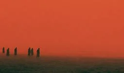 some people going into a red sea 