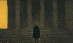 A man in a long coat standing outside a court room 