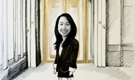 Shermaine Chia in front of a gold door 